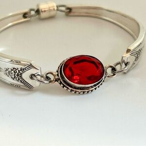 Elegant Silver Bracelet with Red Gemstone
